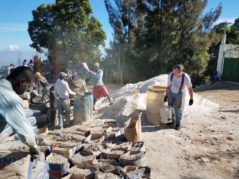 Hand carrying building materials for the mediatechnologies school project